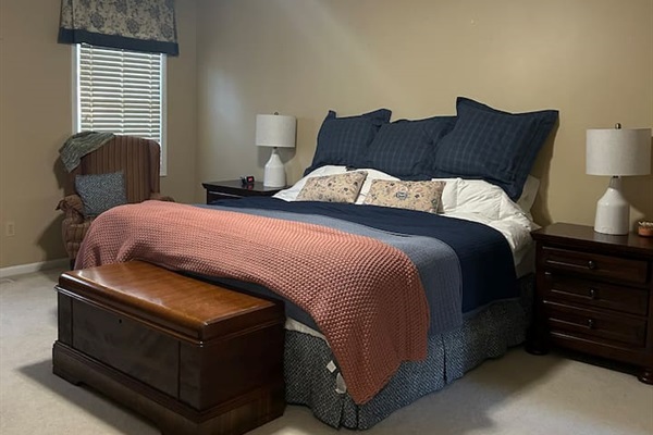 Bedroom #1. Master suite with attached full bathroom. King sized bed with mattress topper. Master bathroom has large tub and walk-in shower.