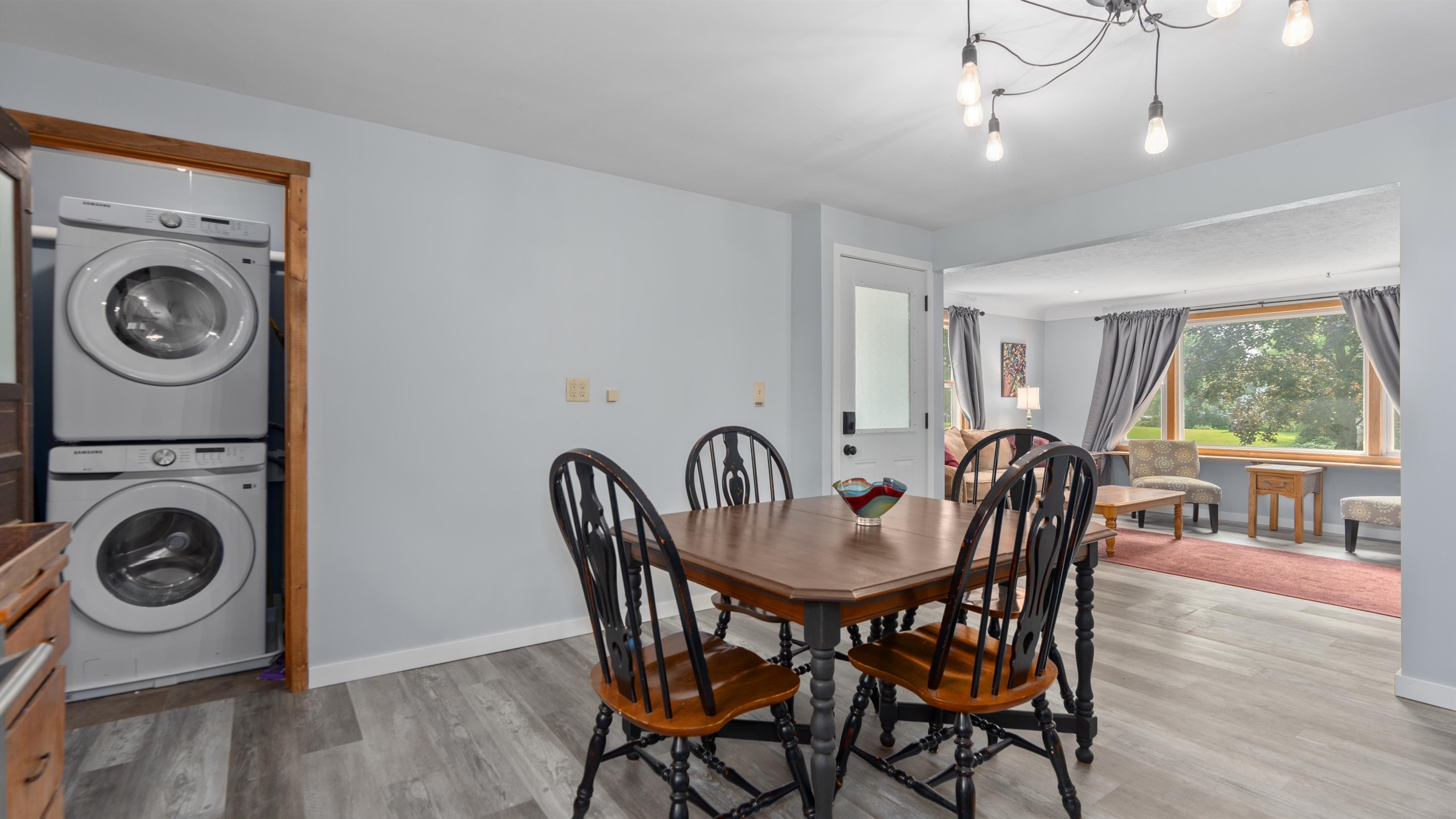 Upstairs dining area with included laundry. 