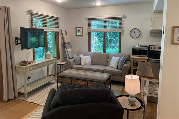 The living room offers a cozy space to spread out and relax.