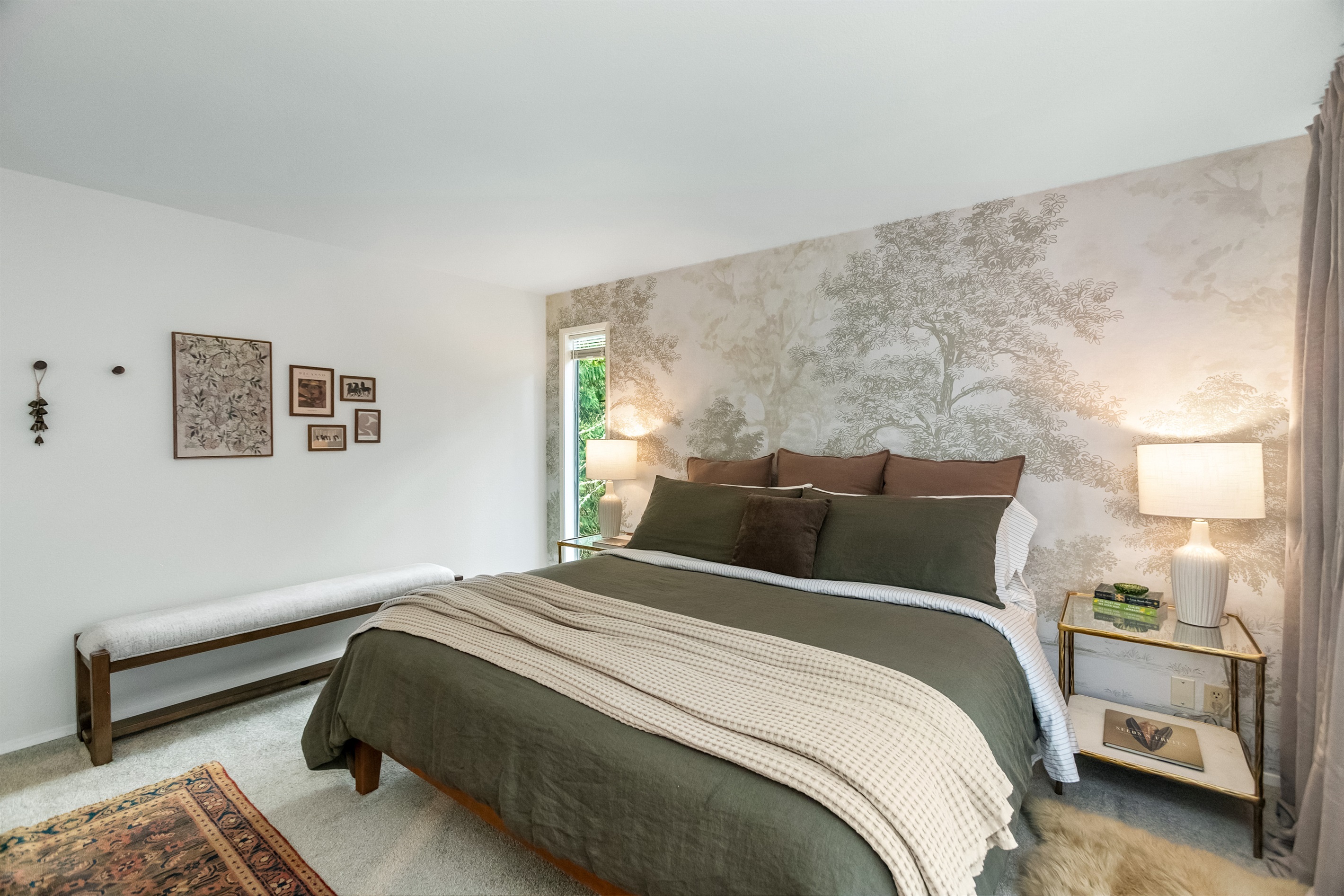 Luxury linens, tasteful murals, and artwork elevate the design of bedrooms throughout.