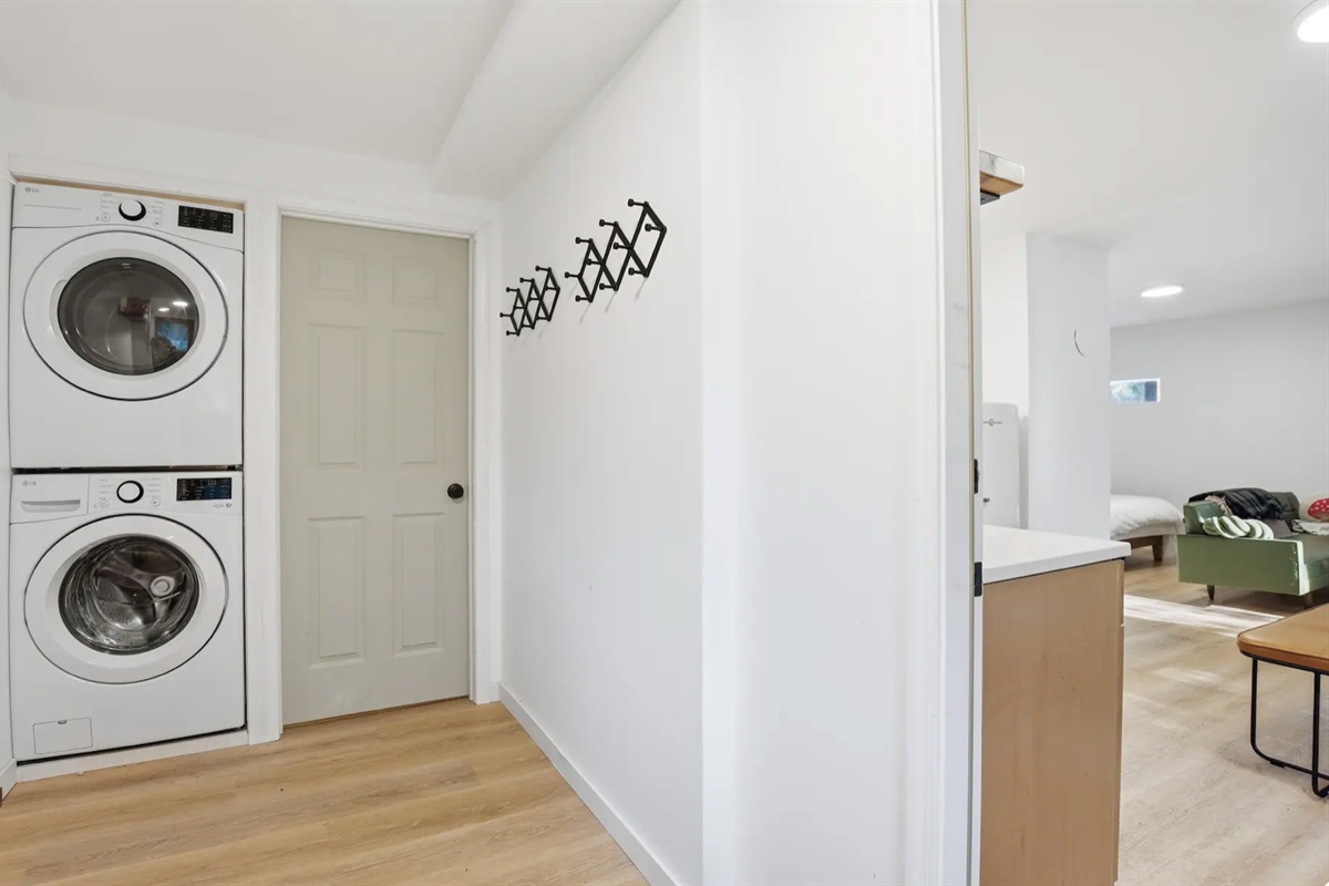 A second washer and dryer located in the studio style suite downstairs.