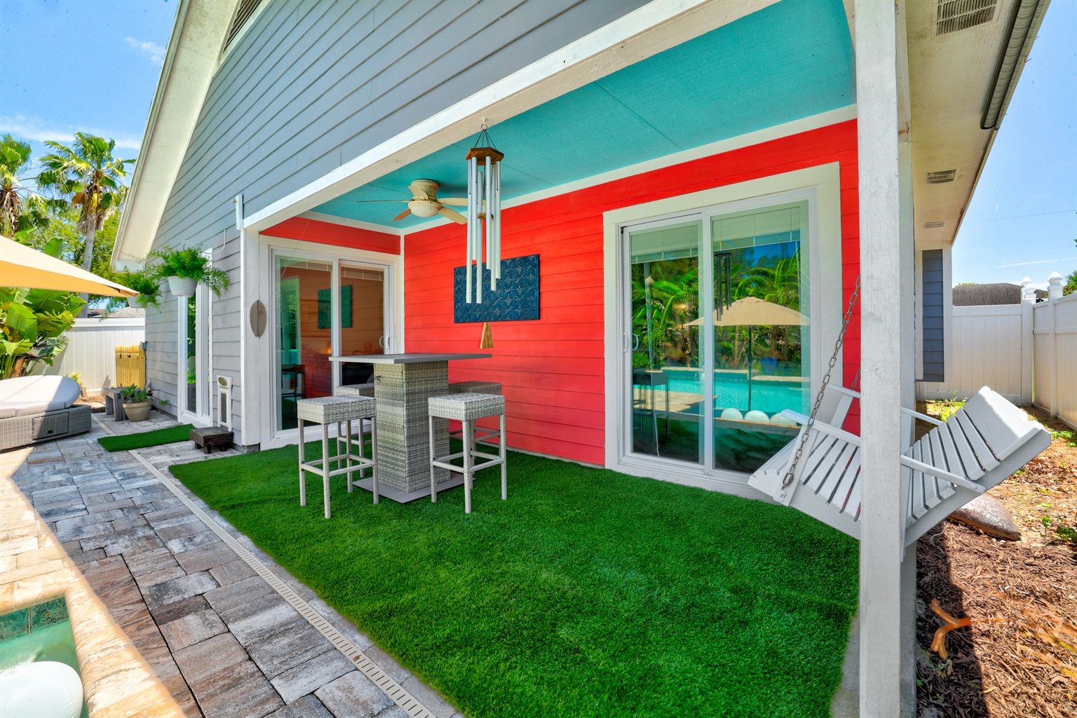 Relaxing patio area, featuring a shaded space.