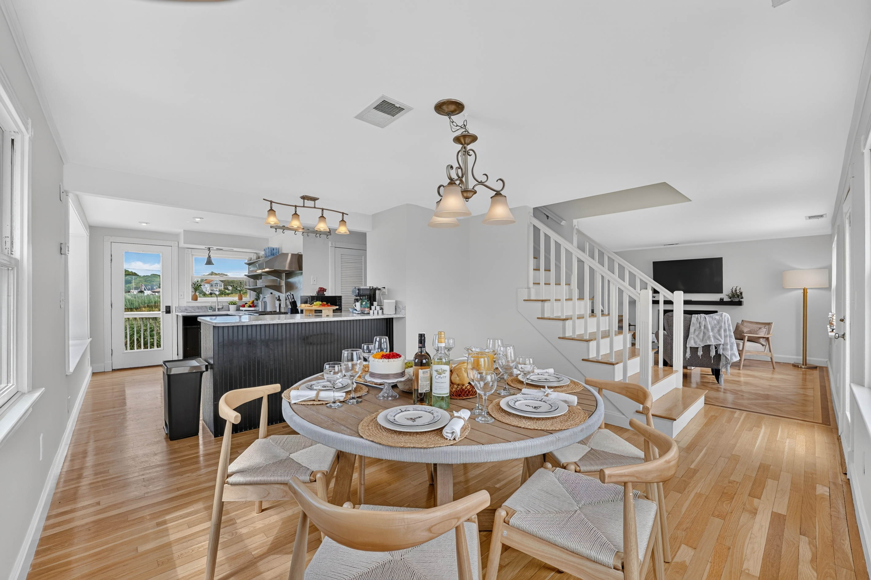 Spacious dining area flows seamlessly into the kitchen and living spaces for easy group gatherings.