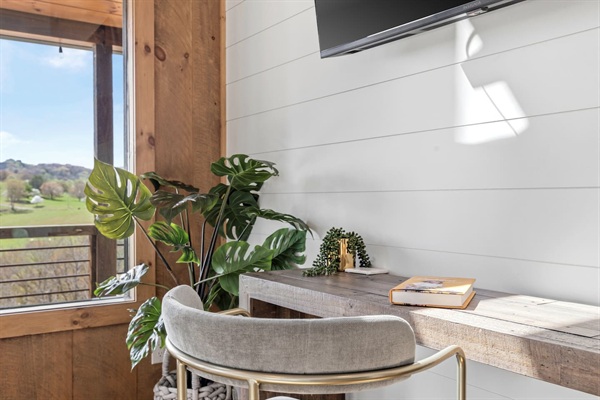 The perfect nook to take those last minute conference calls and catch up on emails. This space is located in the main bedroom on the upper floor. The view outside is stunning!