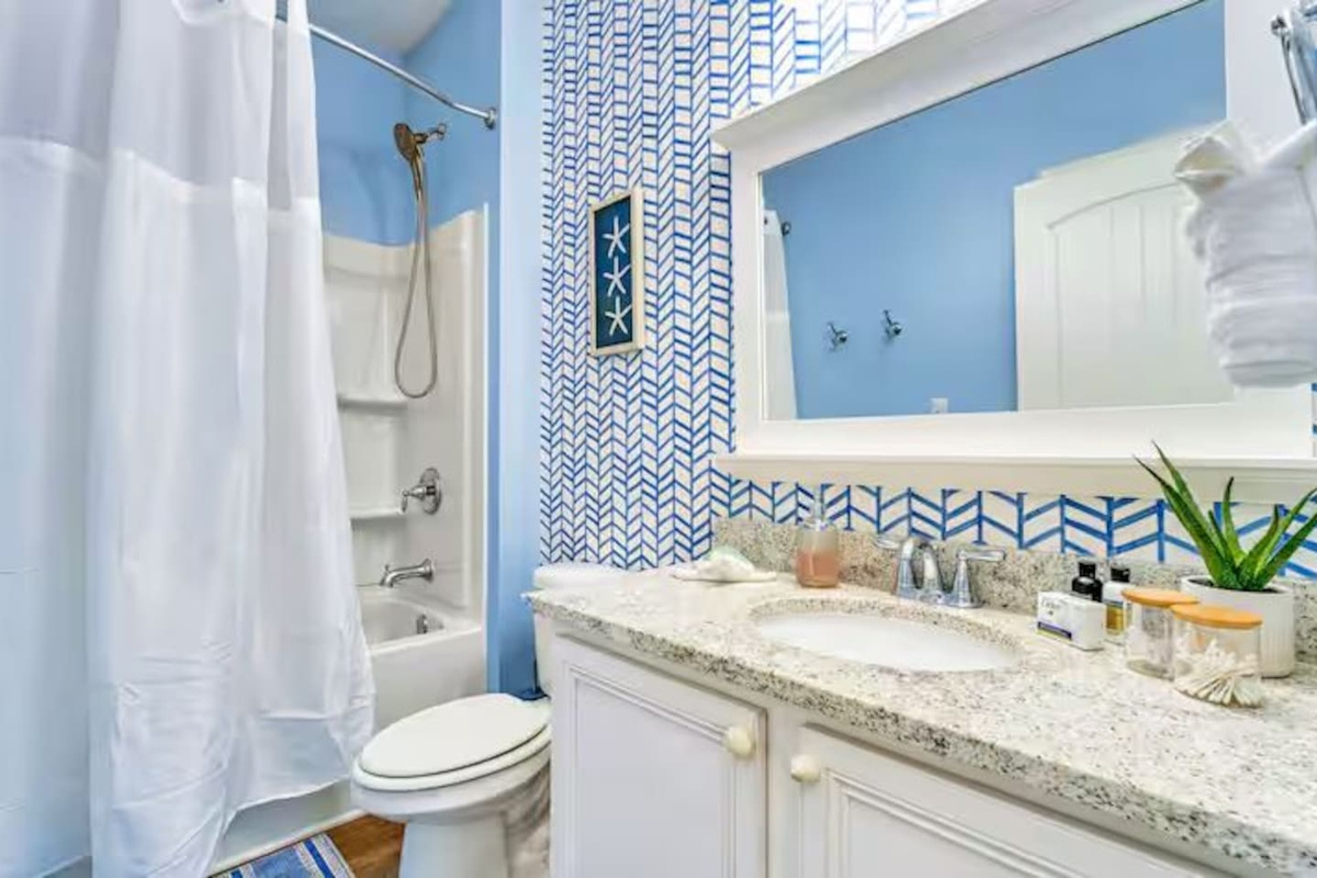 full bathroom beside the bunk room with stylish finishes, a spacious vanity, and everything you need for a comfortable stay