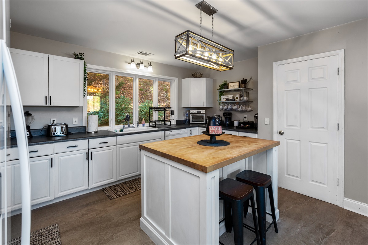 Open concept kitchen, leading to dining room.