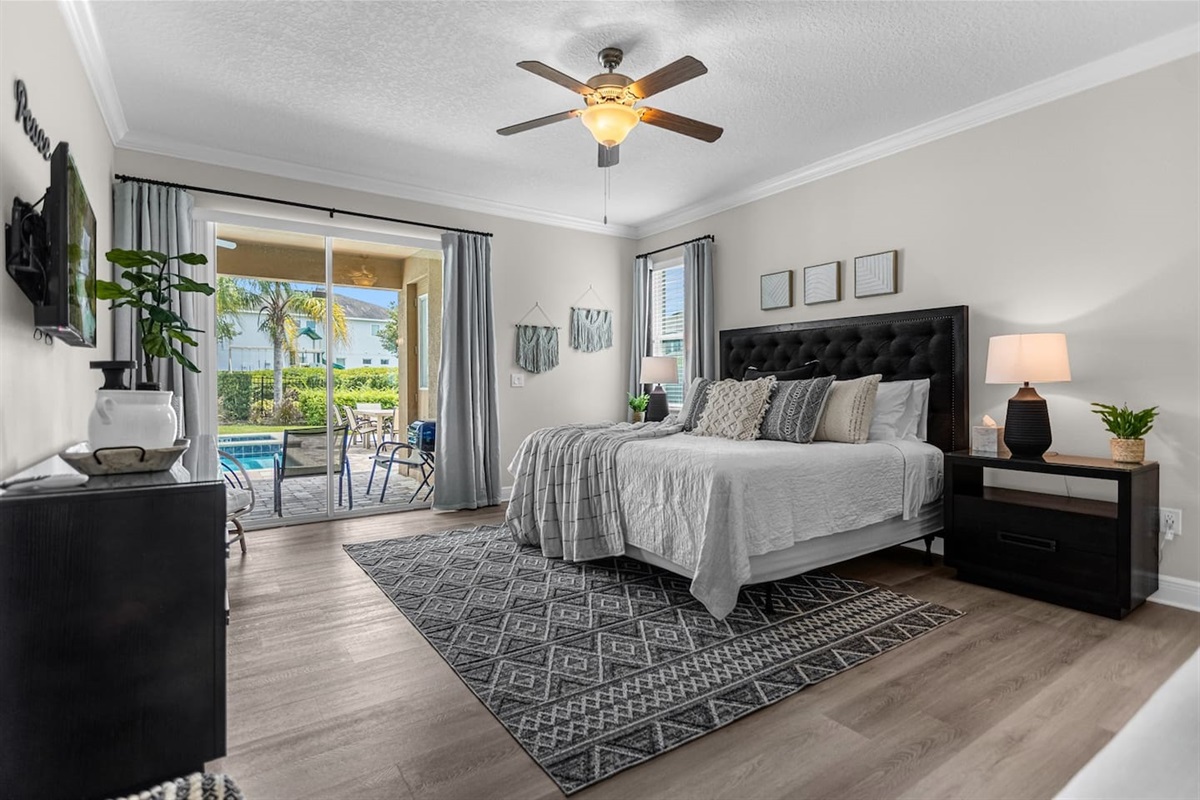 Serene peace-themed bedroom boasting a king-size bed, adorned with peaceful accents and soft textiles, offering a cozy and calming atmosphere for a restful stay.