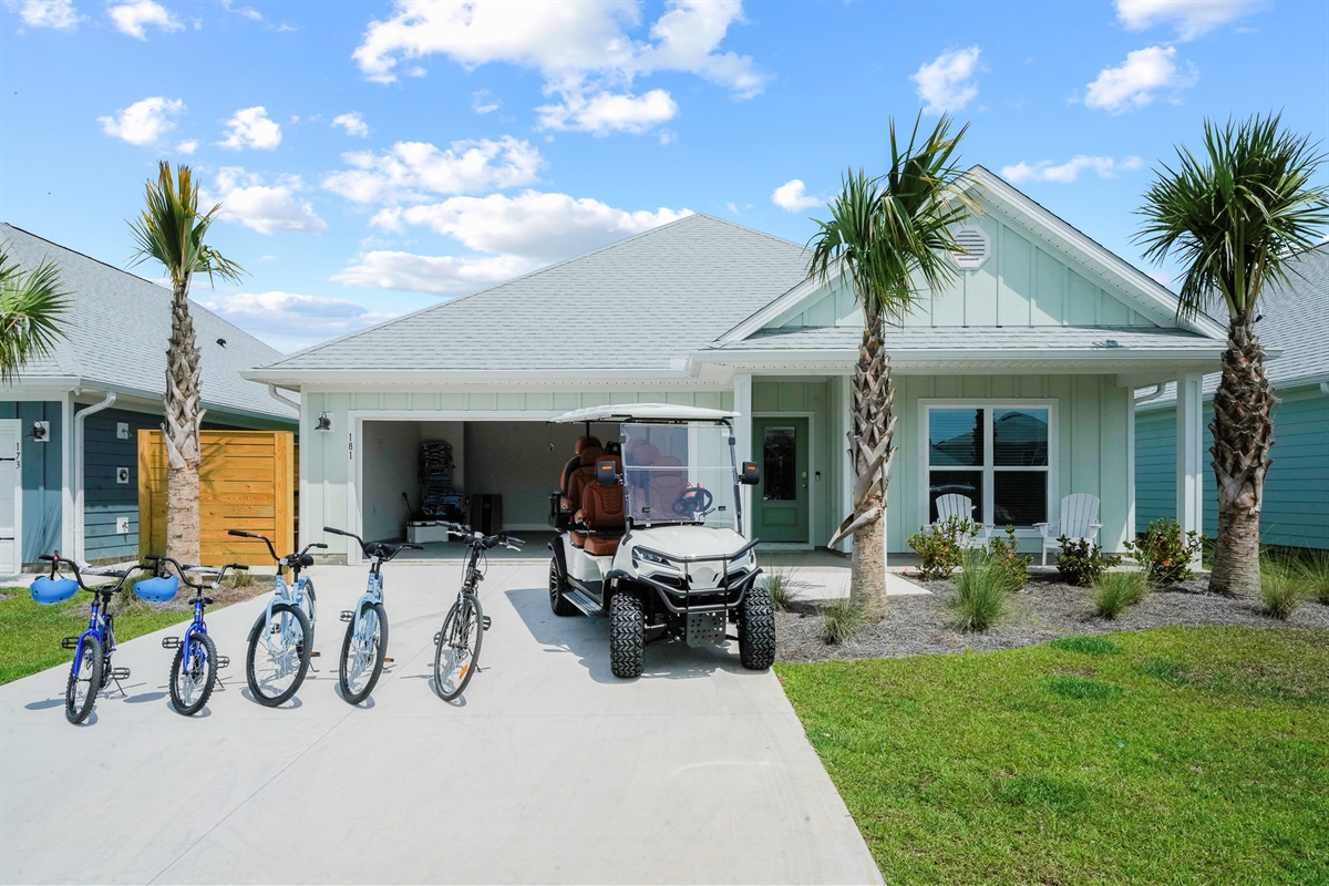 Spacious garage equipped with a 6-seater cart and complimentary bicycles for exploring
