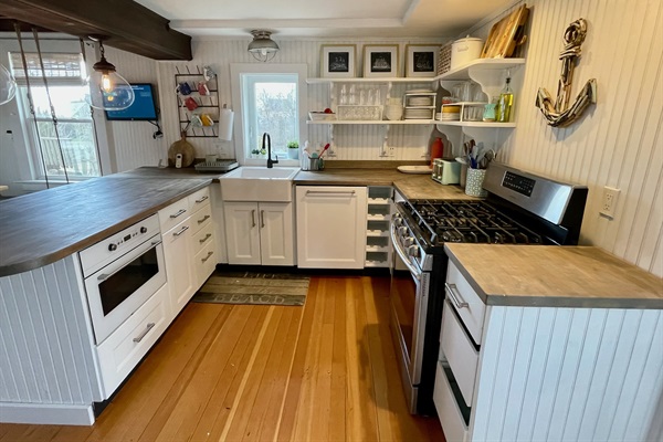 Kitchen with gas range, dishwasher, microwave, Keurig and more!