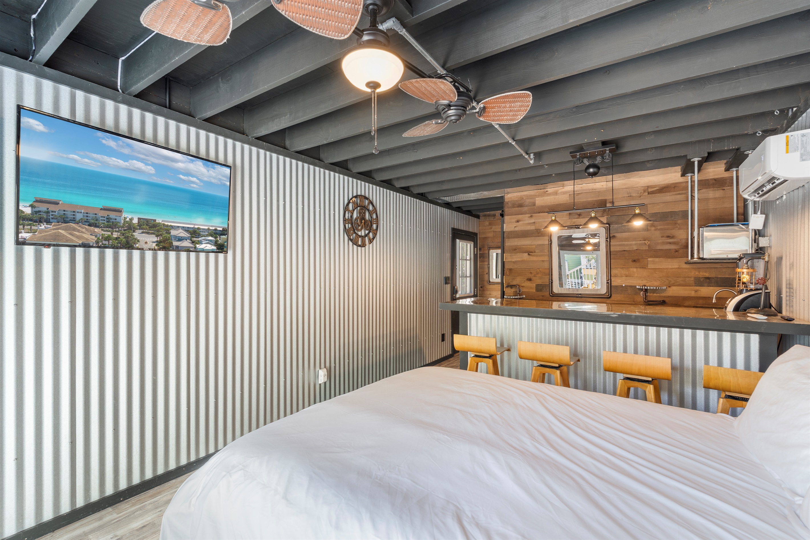 Downstairs casita features a queen bed, kitchenette with a steampunk vibe