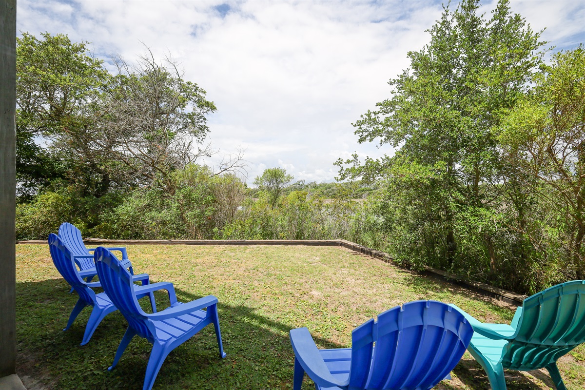 Relaxing lawn chairs await a sunny afternoon