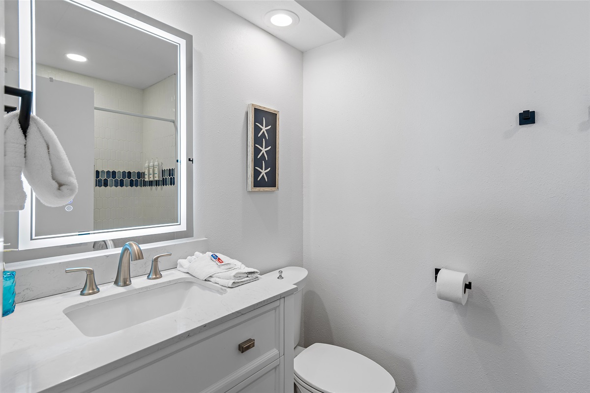 3rd Floor - Bedroom 2: King bed, ensuite bathroom with remodeled shower/tub combo, view of Scenic Gulf Drive, Smart TV (Sleeps 2)