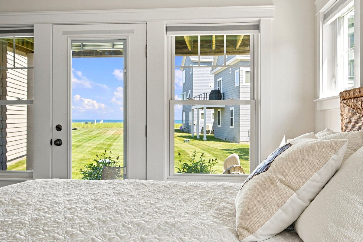 Enjoy relaxing views right from bed through large windows that fill the room with natural light.