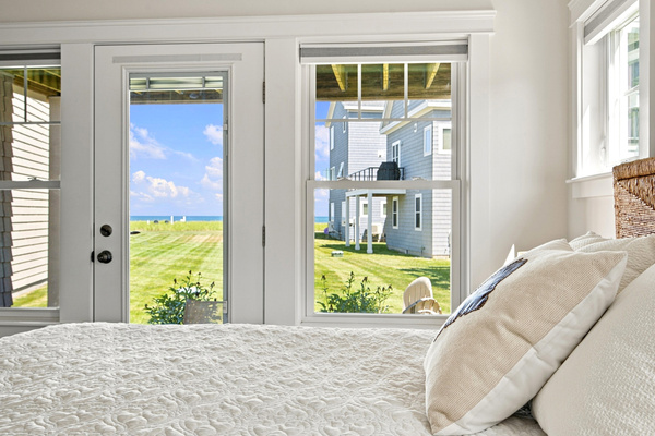Enjoy relaxing views right from bed through large windows that fill the room with natural light.
