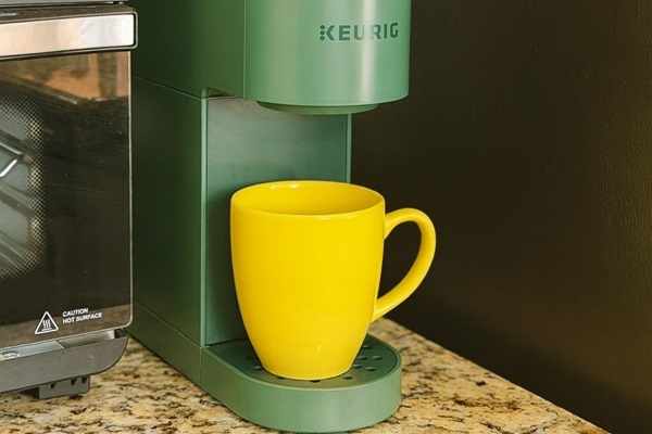 kitchen is well equipped with coffee, tea, culinary, pots, plates for big group to cook and eat.