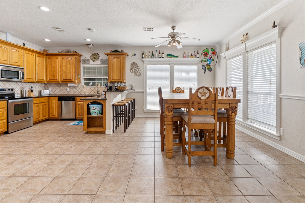 View of dining room and kitchen. Dining room table seats 10