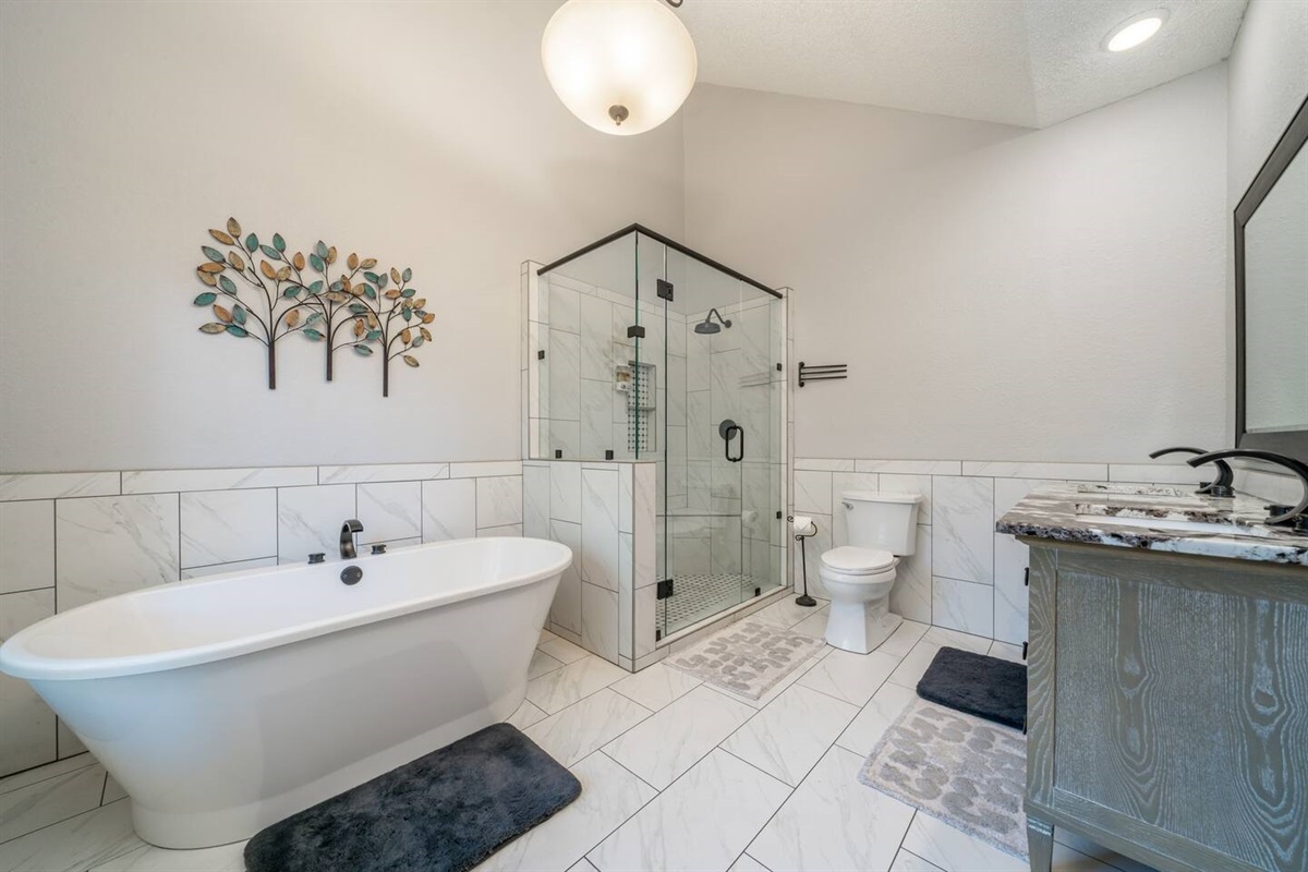 Relax in our amazing soaking tub or experience an incredible walk in shower.  We provide shampoo and body wash and nice soft towels. -Master Bathroom