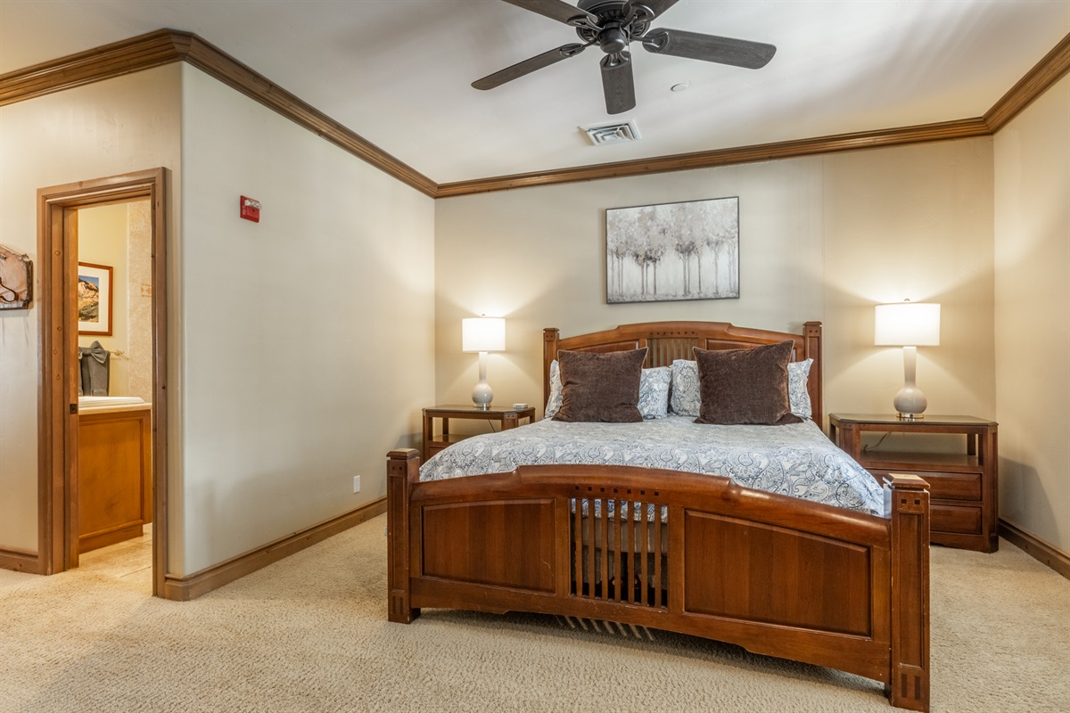 The Charning Chalet primary bedroom and bath are set off in their own hallway, offering added privacy and a quiet, secluded feel.