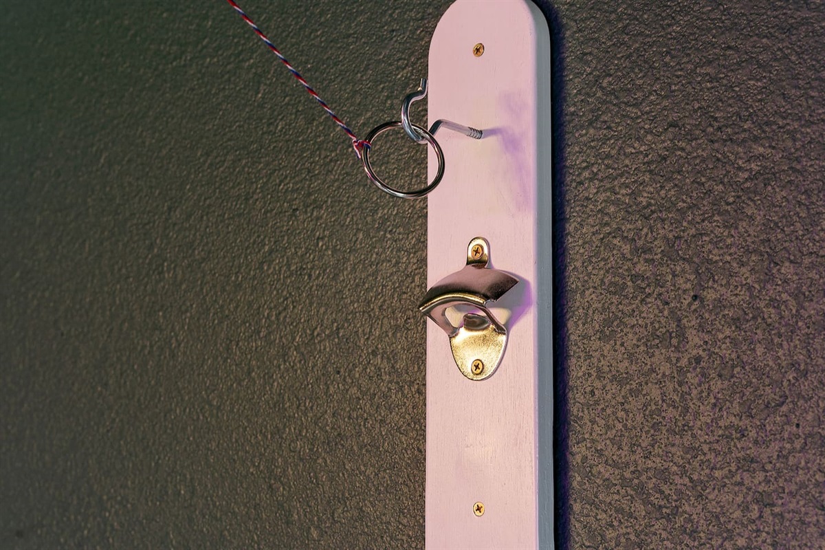 Step into this charming nook featuring a wall-mounted bottle opener with a handy cap catcher, perfect for entertaining.