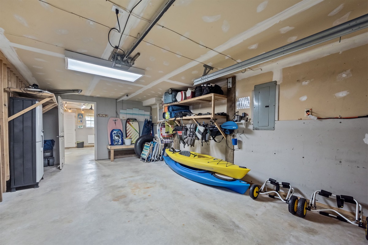 Large garage area with beach gear and storage space