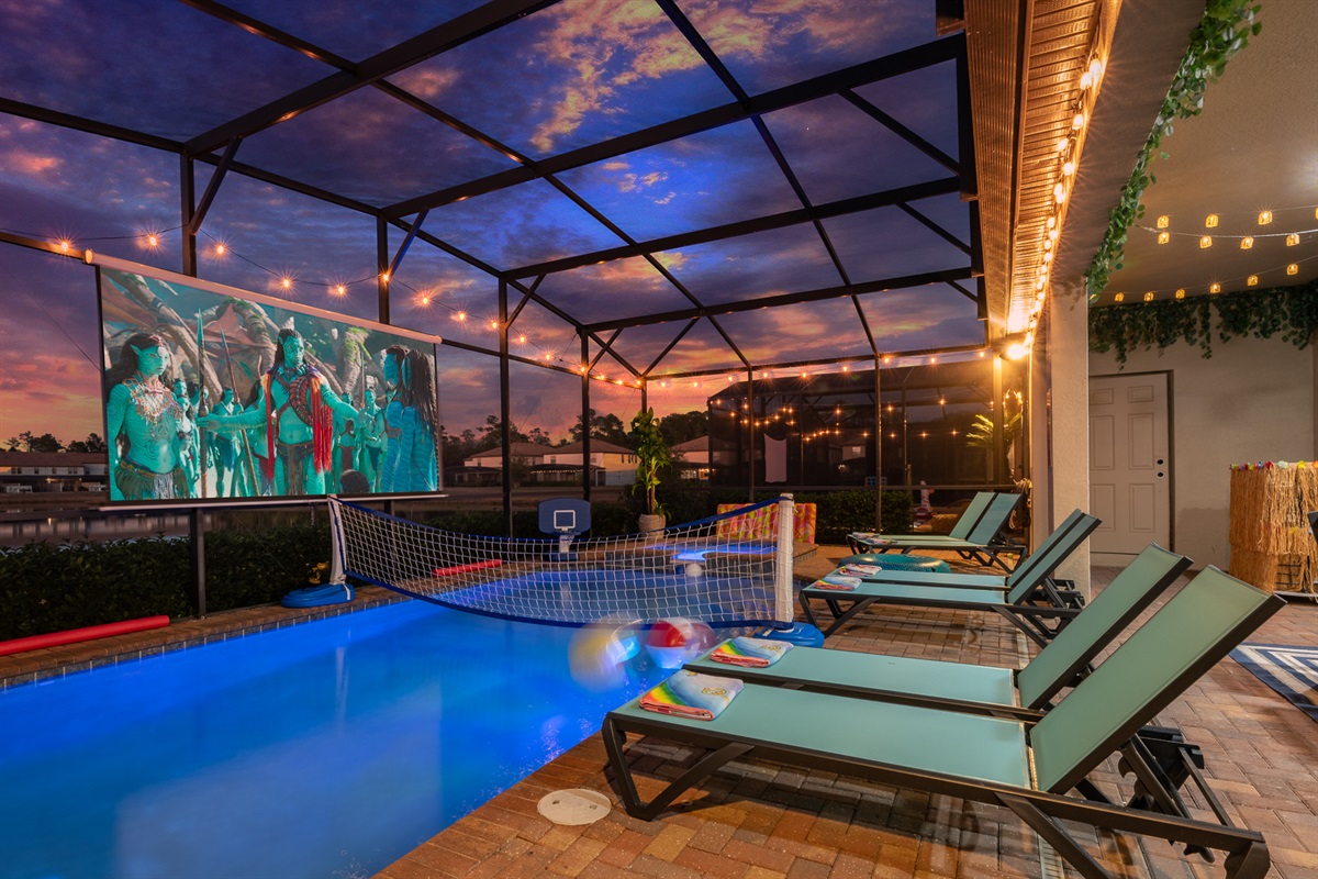 Enjoy a movie by the pool with a stunning lake view