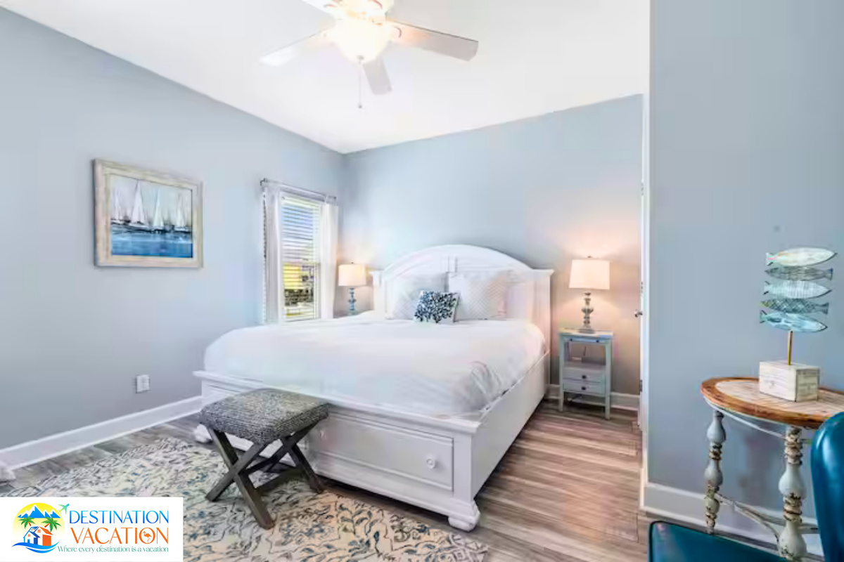 Soft coastal tones create peaceful bedroom comfort.