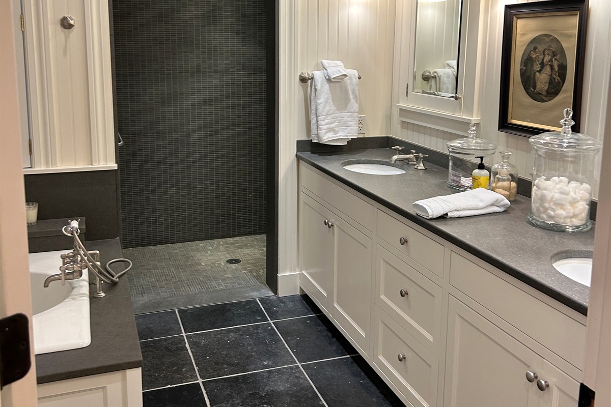 Primary suite located on the first floor, handicap, accessible, walk-in shower, double sinks