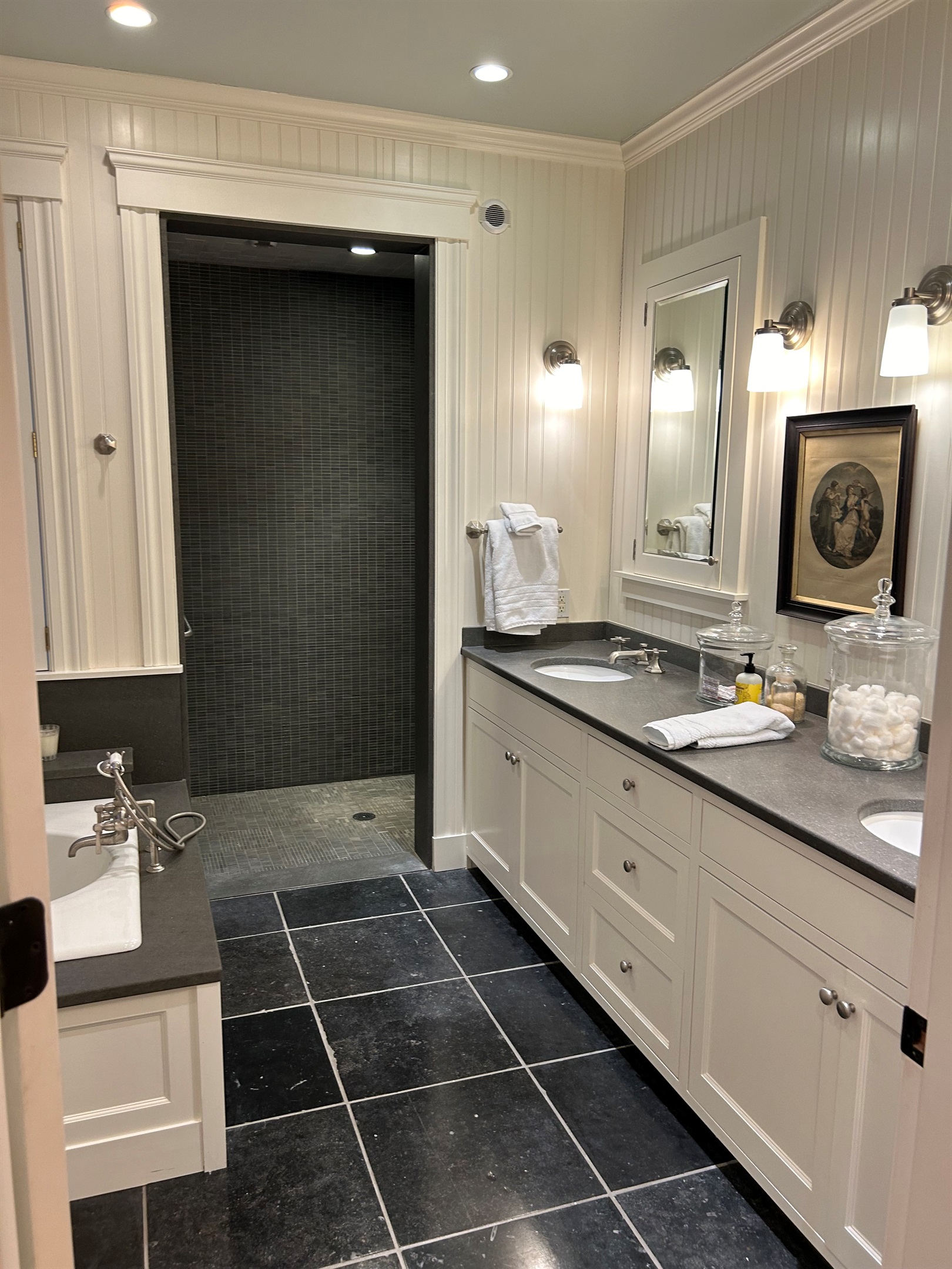 Primary suite located on the first floor, handicap, accessible, walk-in shower, double sinks