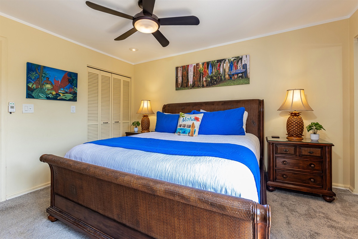 Main floor guest bedroom with 2 closets and ceiling fan