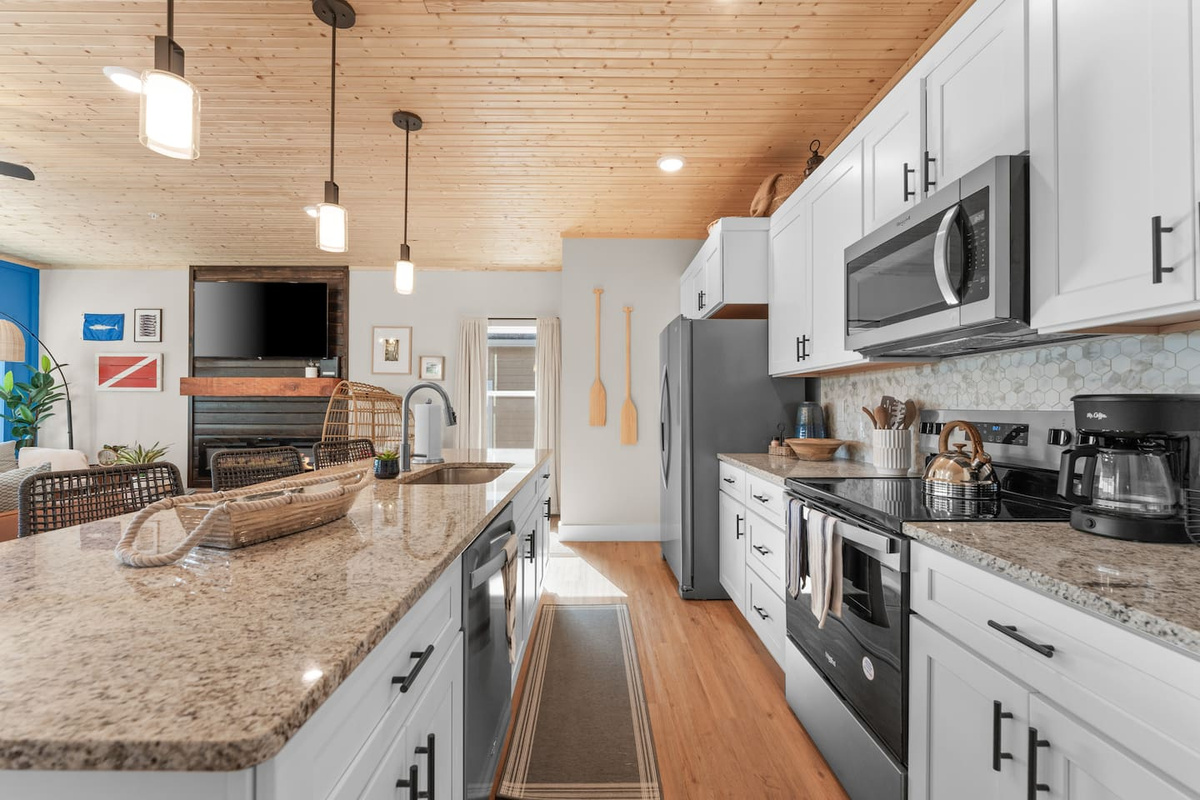 Fully stocked kitchen with large island for gathering