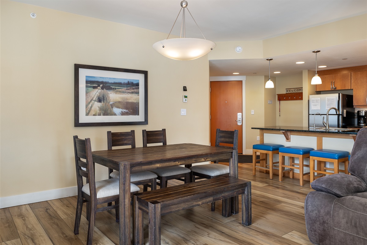 Dining table has 4 chairs and a bench seat