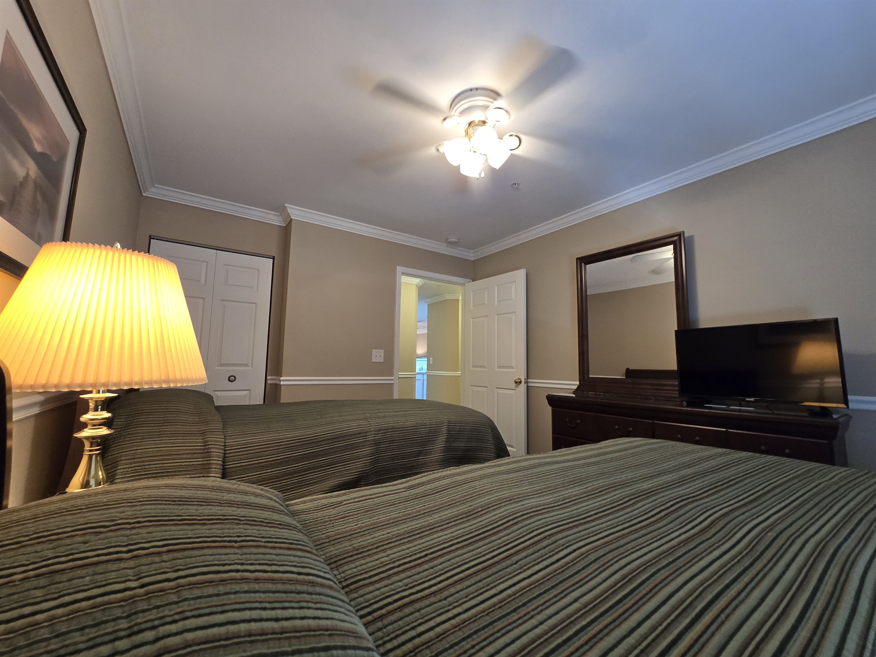 3rd bedroom with closet/dresser storage and TV
