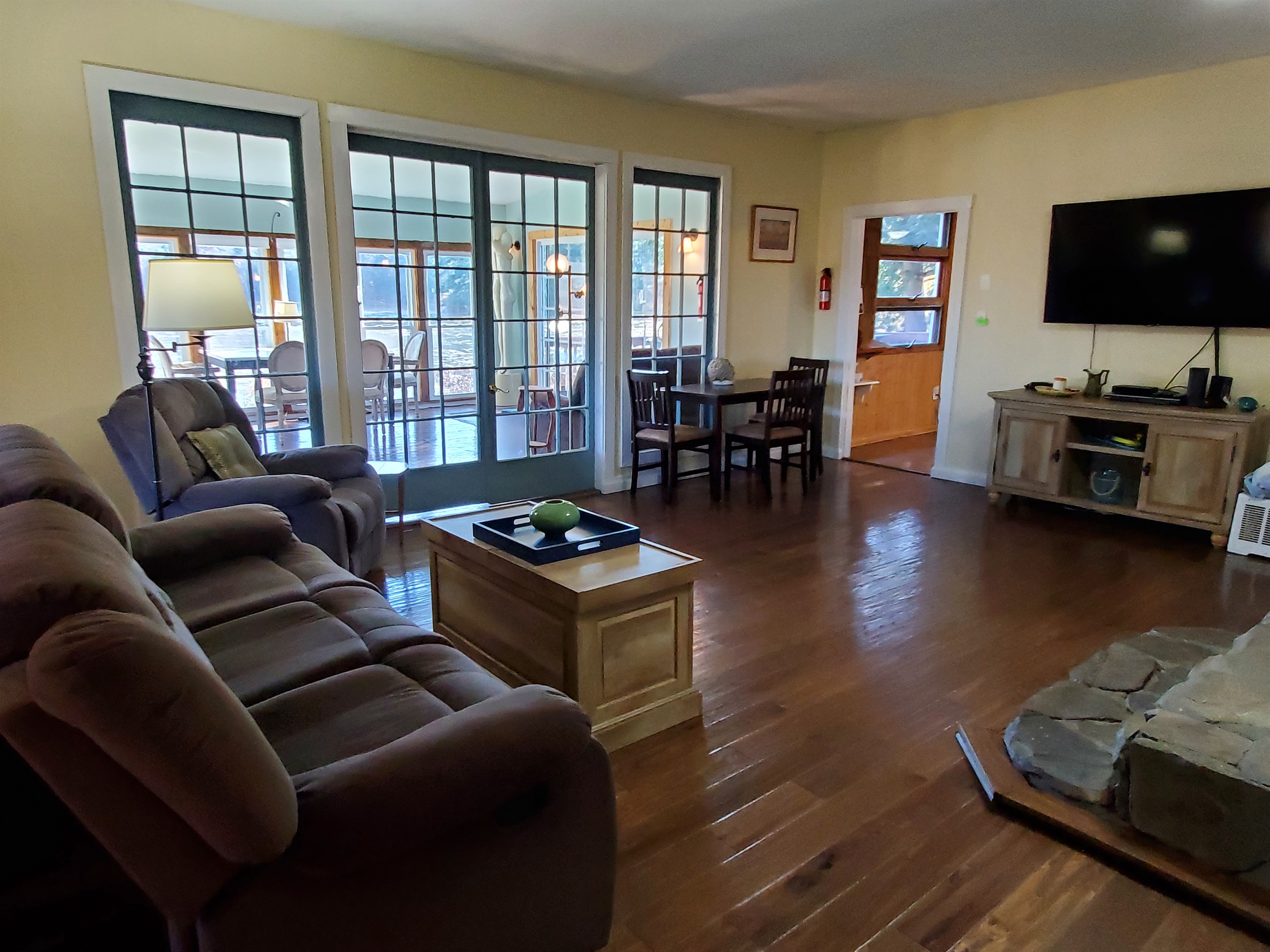 Nature's Hidden Treasure spacious open living room with large smart TV.