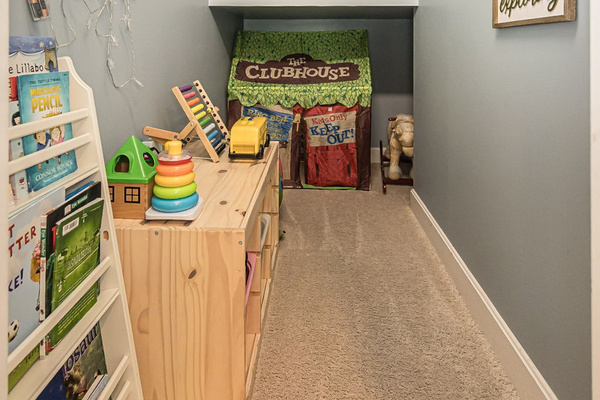 Kids will love their own play area tucked beneath the stairs.
