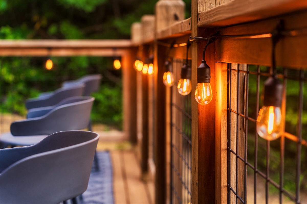 Enjoy your coffee on the rockers on the back deck with string lights