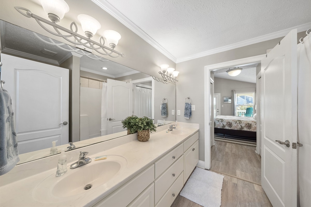 Full Jack-N-Jill bathroom between the two kind bedrooms. Double sinks with a tub/shower combination