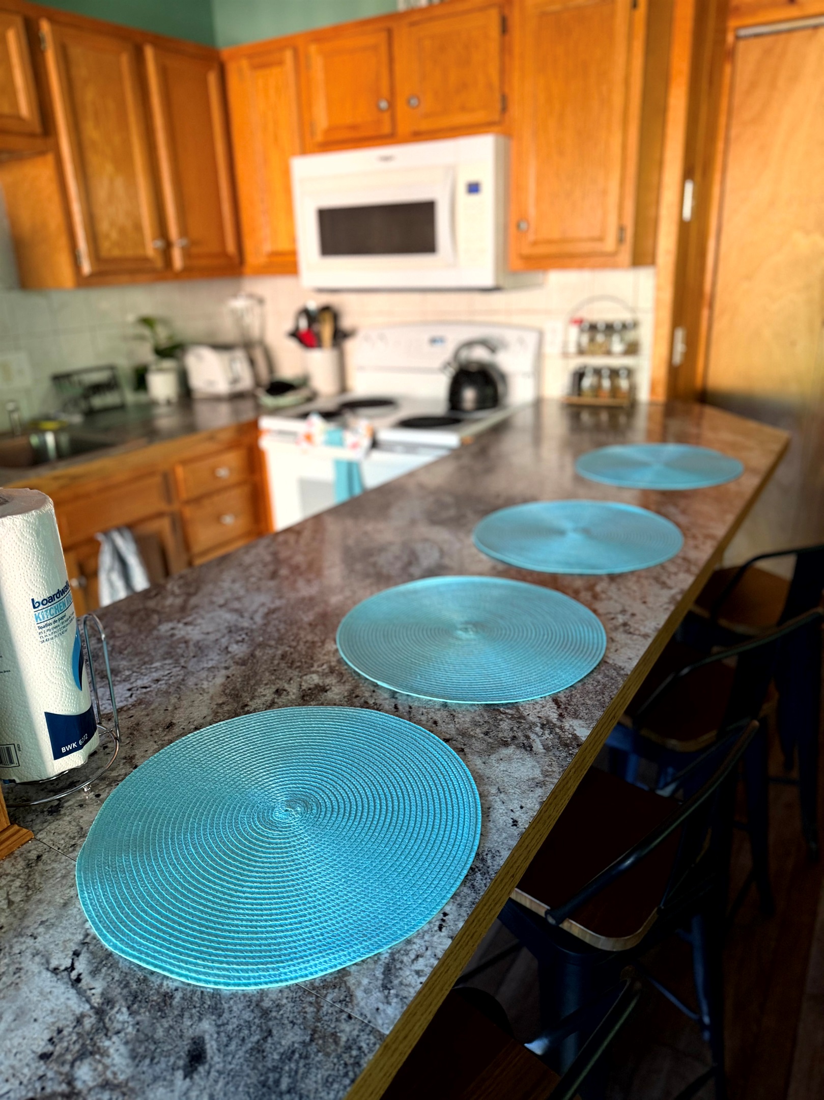 Kitchen bar seating (4 stools) — an easy spot for coffee, quick breakfasts, and kid-approved snacking at Grey Haven.  
