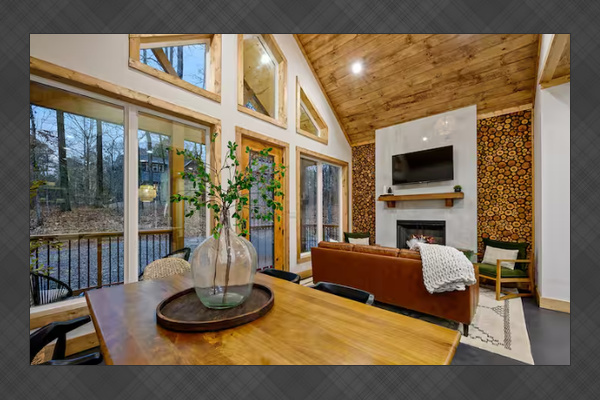 Open-concept living space with forest views
