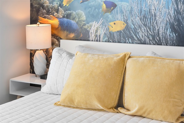 You sleep with the fish if you're lucky enough to get this room for your vacation.  A large underwater mural makes it seem like you could reach out and touch the fish while you fall asleep in the king size bed.