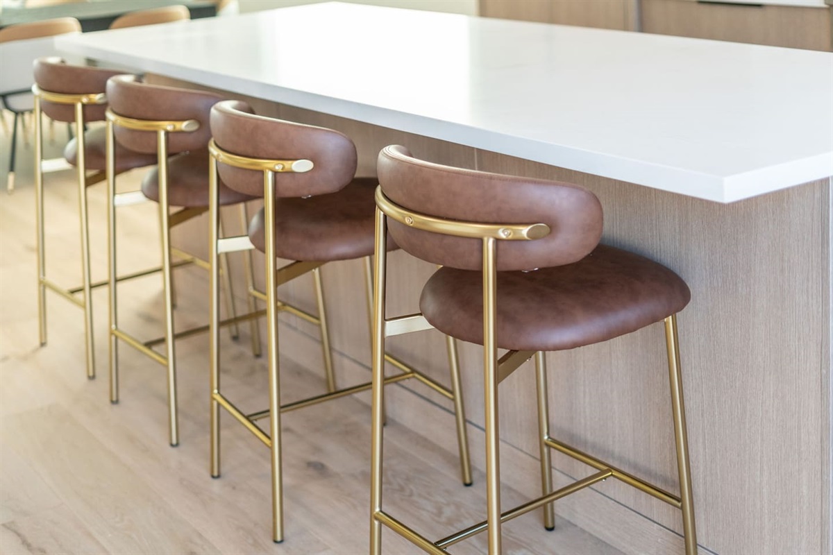 Spacious kitchen island with seating for four — ideal for casual meals or morning coffee.