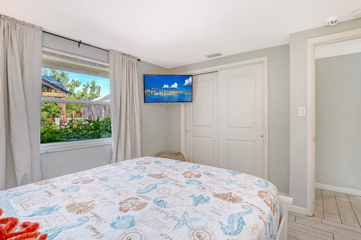 Queen guest room with Samsung smart TV