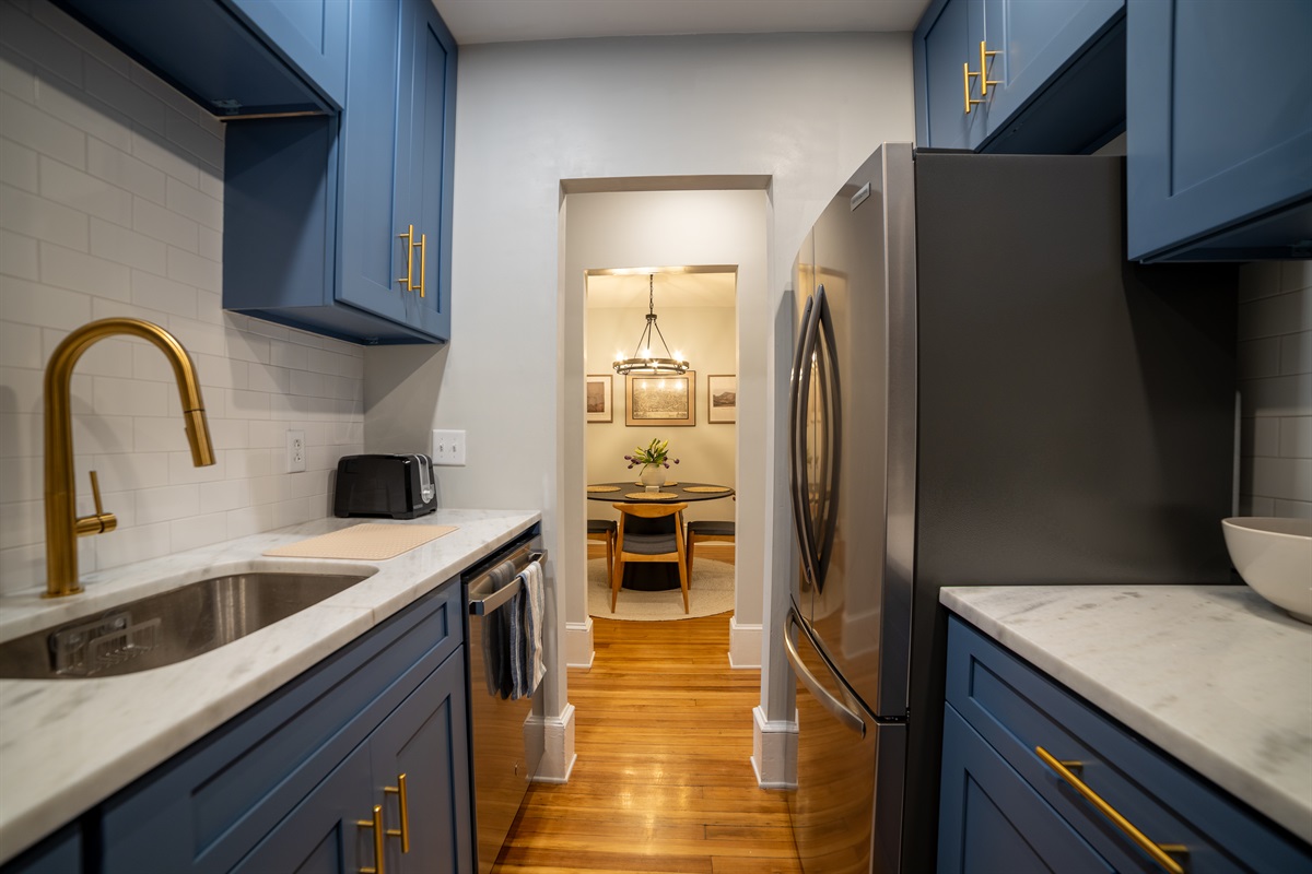 Galley kitchen directly across from dining room