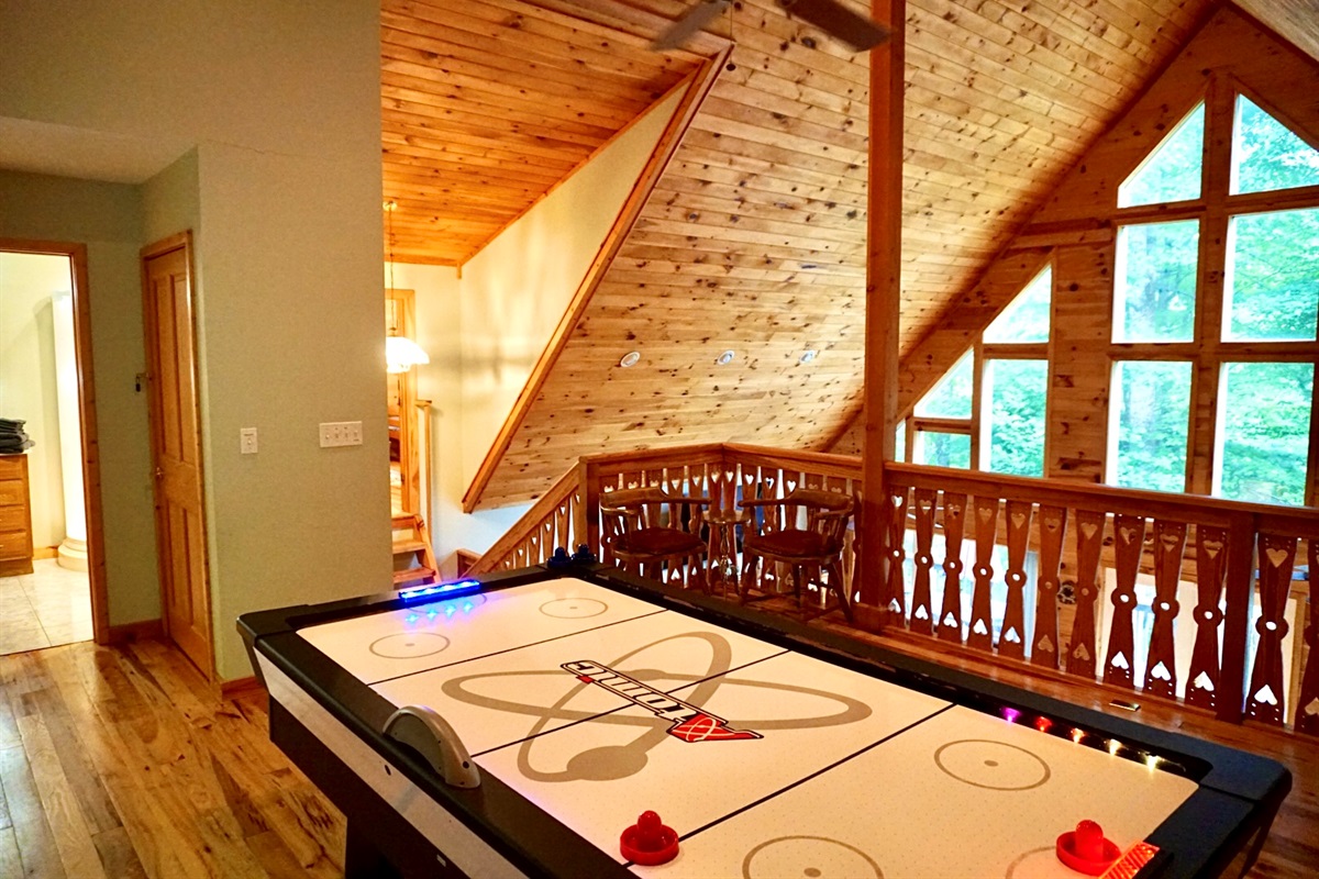 Enjoy friendly competitions and stunning views in this lively air hockey space!