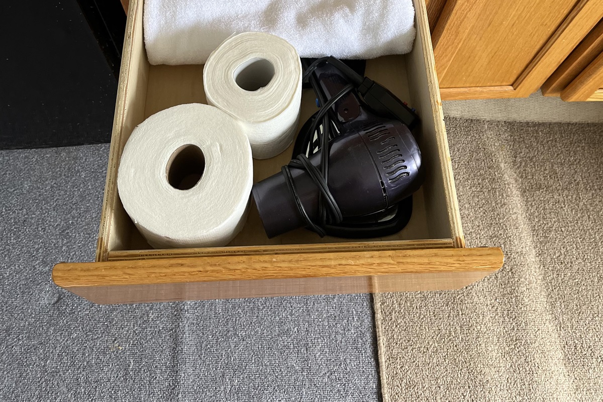 A hair dryer and plenty of sheets and towels are provided for your convenience. 