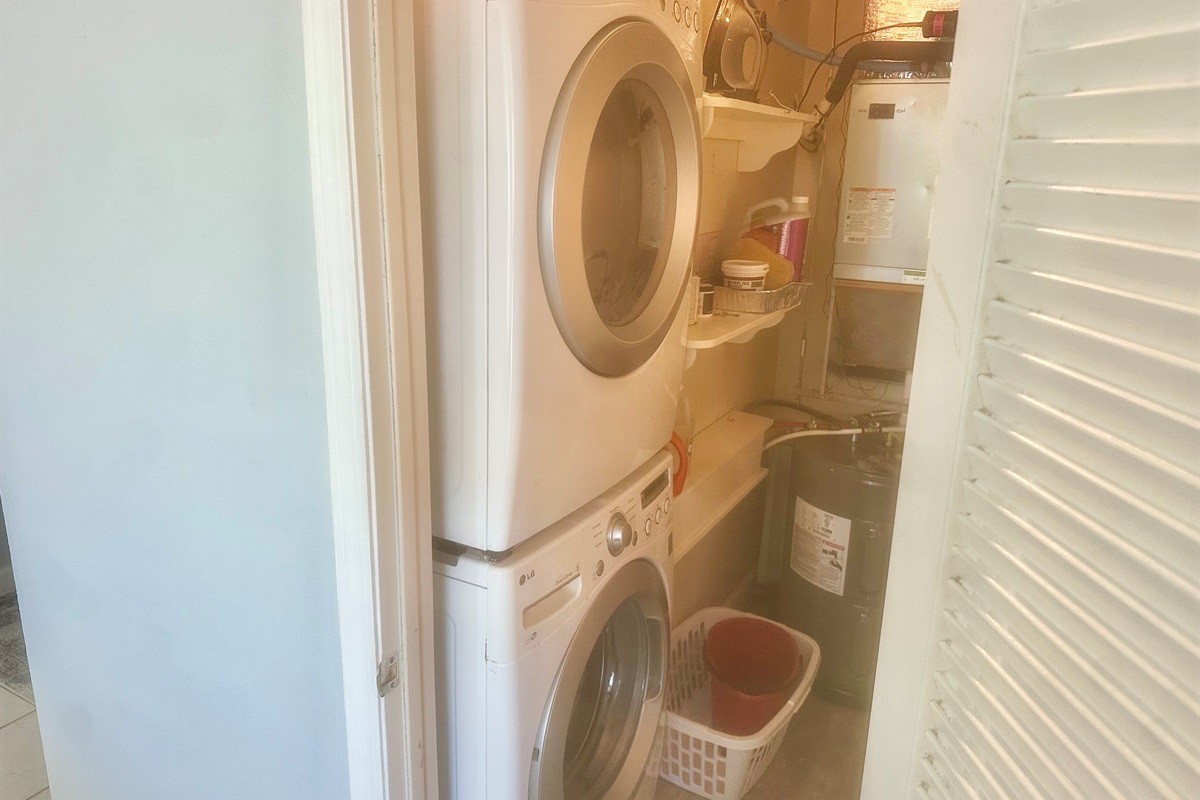 Full sized stackable washer and dryer in our unuit.