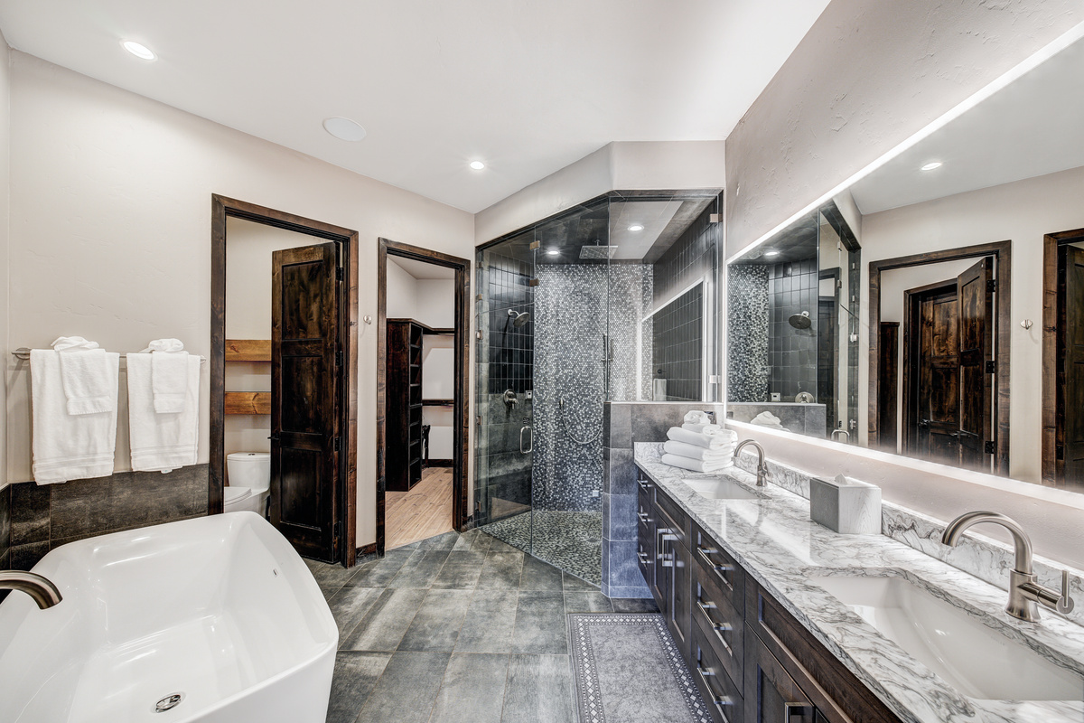 Bedroom #1 w/ensuite bath, private hot tub, fireplace, and laundry in closet.