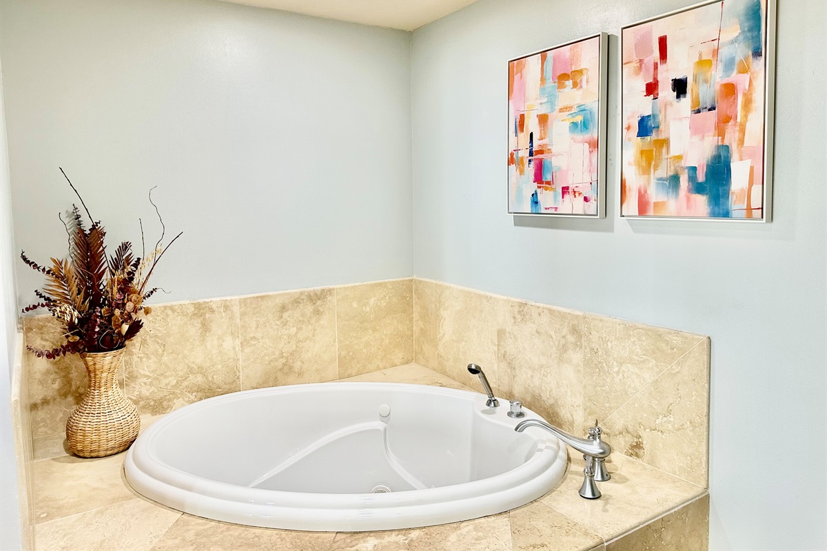 Lovely soaking tub in the master bathroom.