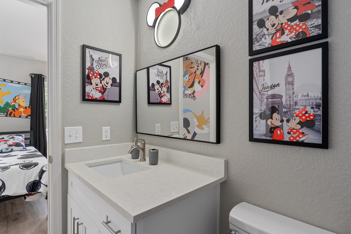 Private ensuite bathroom attached to the kids’ Disney-themed bedroom