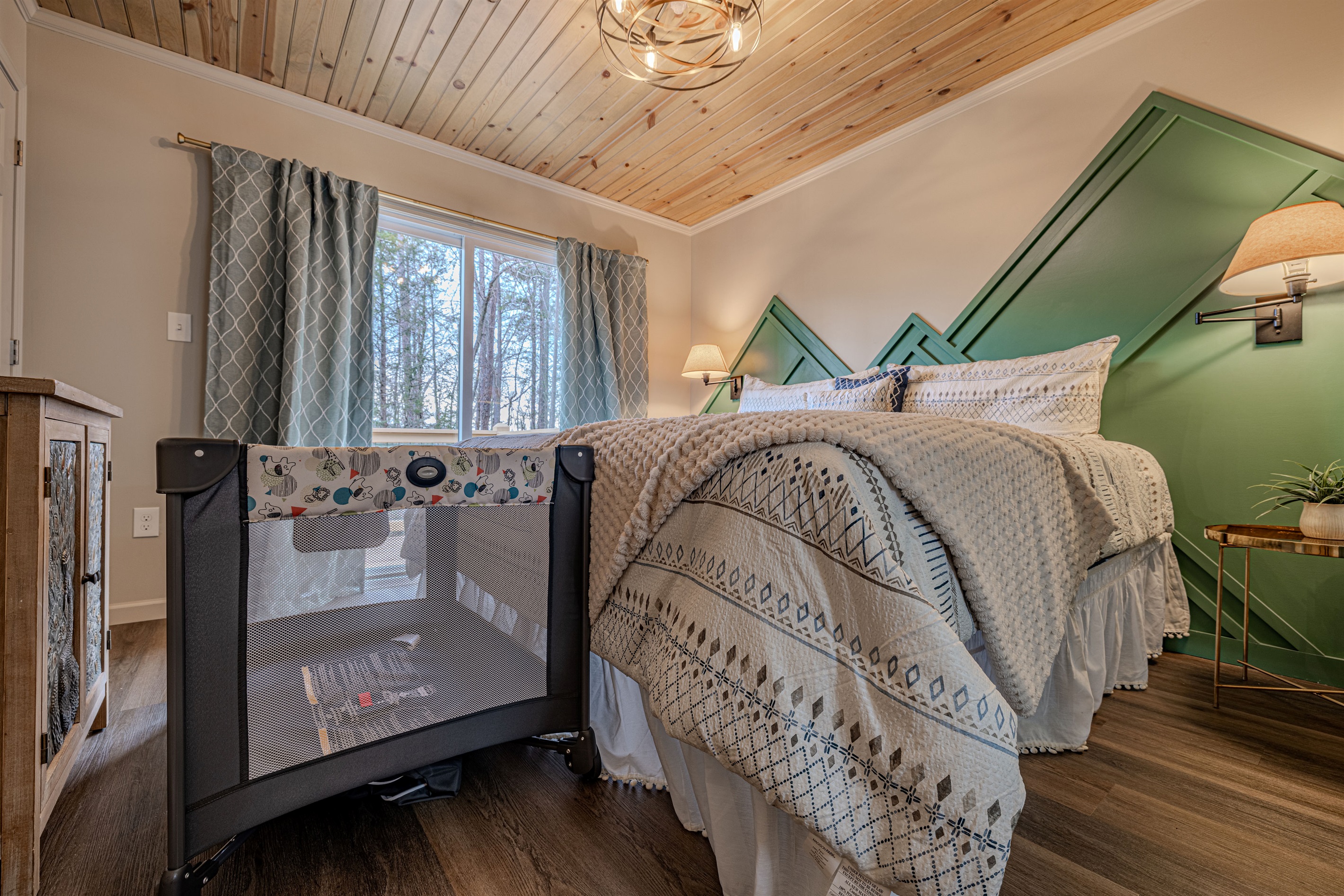 A thoughtful retreat for the whole family. This bright bedroom combines our signature mountain aesthetic with the practical comforts needed for those traveling with littles.