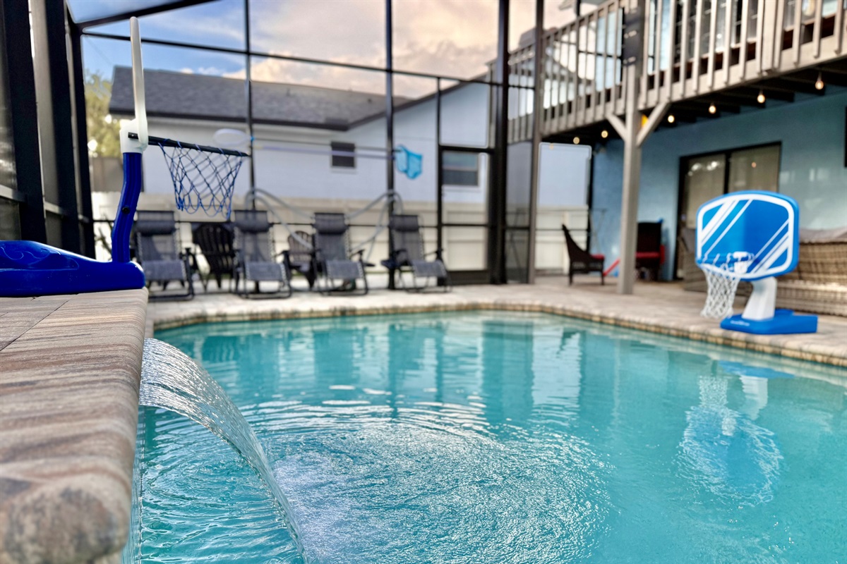 Take a dip in the crystal-clear waters of this inviting pool, framed by elegant paver decking and highlighted by a soothing cascading waterfall.